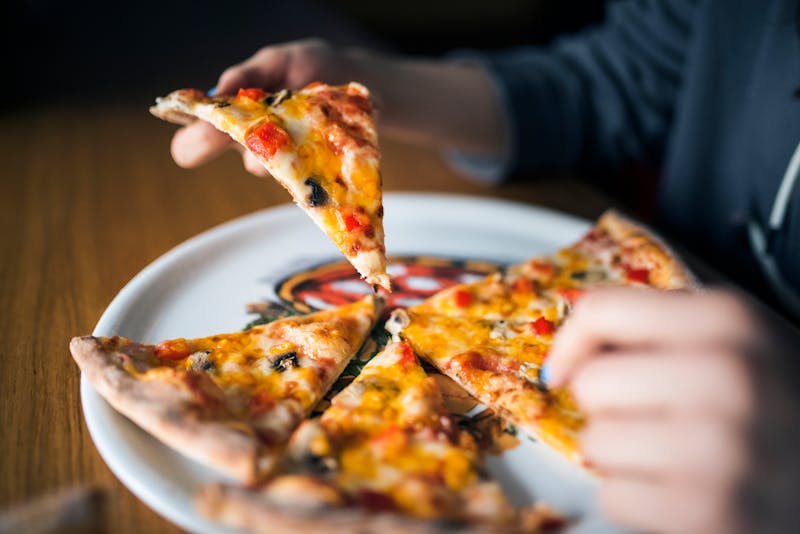 Dewey's BBQ chicken specialty pizza with caramelized onions and cilantro